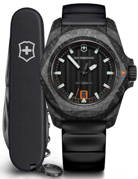 Black Victorinox watch with luminescent markers, date at 6, "AUTOMATIC" text, and Swiss Army knife.