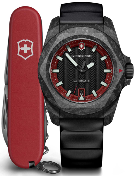Victorinox men\'s watch with chevron face, red accents, date at 6 o\'clock, and Swiss Army knife.
