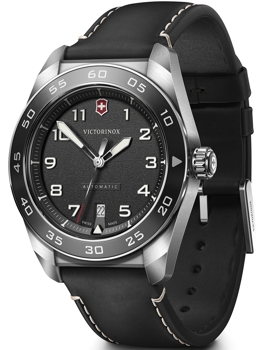Black dial watch with white numerals, date at 6, black strap with stitching, and silver bezel.